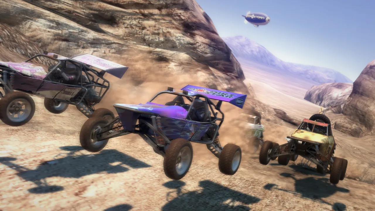 Three buggy's are airborn in a desert race