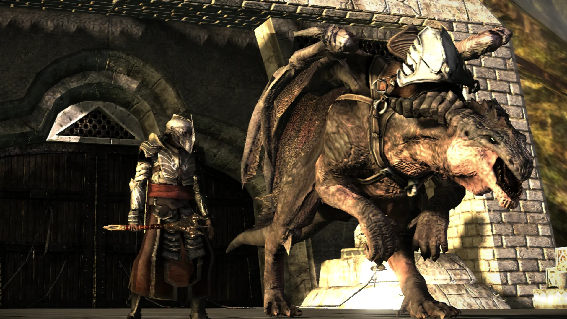 A rider stands next to his dragon covered in the saddle